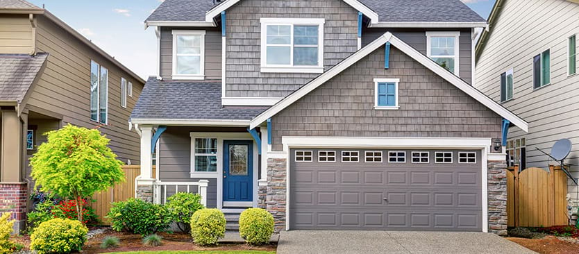 Gray house with blue door and trim